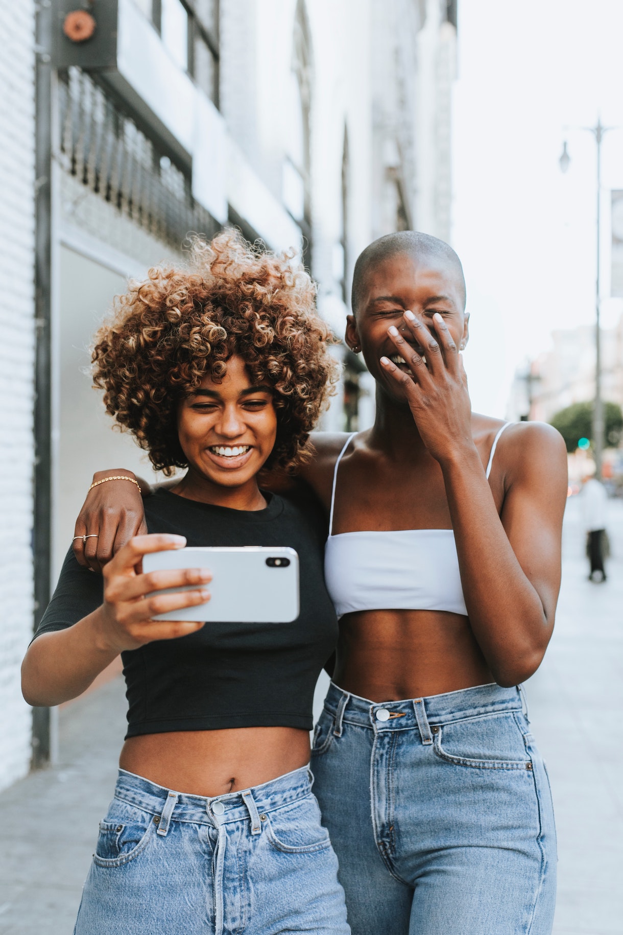 two women embraced and laughing