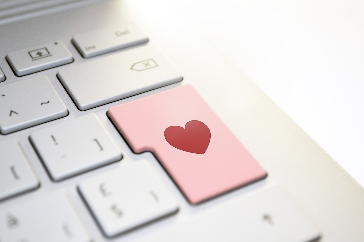 zoomed in keyboard with pink key with heart on it